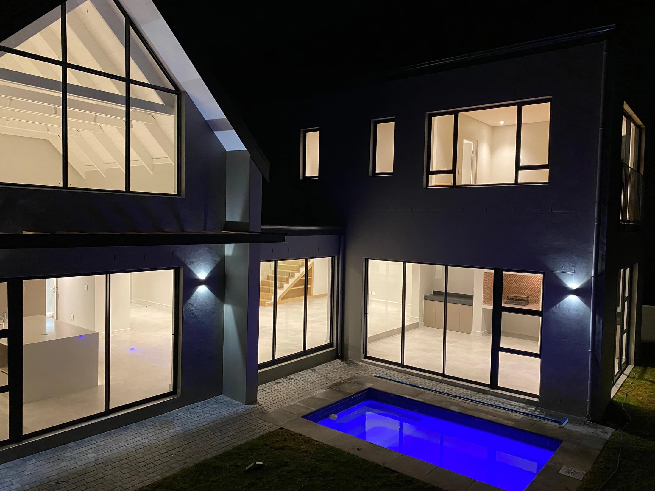 Longlands 362 — courtyard and pool after dark